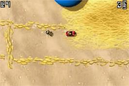 In game image of Micro Machines on the Nintendo Game Boy Advance.