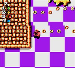 In game image of Micro Machines 1 and 2: Twin Turbo on the Nintendo Game Boy Color.