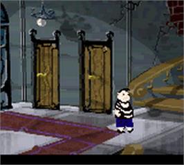 In game image of New Addams Family Series on the Nintendo Game Boy Color.