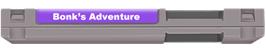 Top of cartridge artwork for B.C. Kid / Bonk's Adventure / Kyukyoku!! PC Genjin on the Nintendo NES.