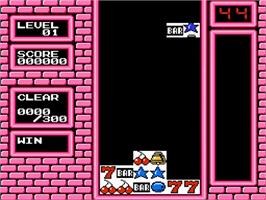 In game image of Puzslot on the Nintendo NES.