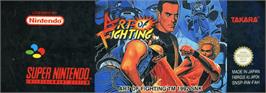 Top of cartridge artwork for Art of Fighting on the Nintendo SNES.
