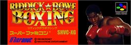 Top of cartridge artwork for Riddick Bowe Boxing on the Nintendo SNES.