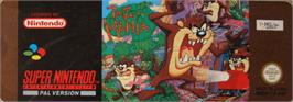 Top of cartridge artwork for Taz-mania on the Nintendo SNES.