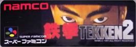 Top of cartridge artwork for Tekken 2 on the Nintendo SNES.