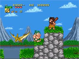 In game image of Joe & Mac: Caveman Ninja on the Nintendo SNES.