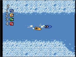 In game image of Micro Machines on the Nintendo SNES.