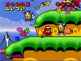 In game image of Plok on the Nintendo SNES.