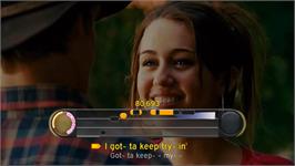 In game image of Disney Sing It - Pop Hits on the Nintendo Wii.