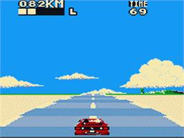 In game image of Out Run on the Sega Game Gear.