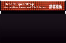 Cartridge artwork for Desert Speedtrap starring Road Runner and Wile E. Coyote on the Sega Master System.