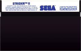 Cartridge artwork for Strider 2 on the Sega Master System.