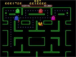 In game image of Ms. Pac-man on the Sega Master System.