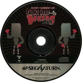 Cartridge artwork for Funky Head Boxers Plus on the Sega Saturn.