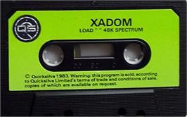 Cartridge artwork for Xadom on the Sinclair ZX Spectrum.