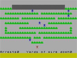 In game image of Base Invaders (Work Force) on the Sinclair ZX Spectrum.
