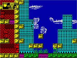 In game image of CJ in the USA on the Sinclair ZX Spectrum.