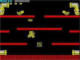 In game image of Mario Bros. on the Sinclair ZX Spectrum.