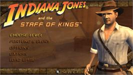 Title screen of Indiana Jones And The Staff Of Kings on the Sony PSP.