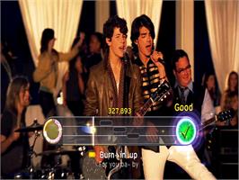 In game image of Disney Sing It - Pop Hits on the Sony Playstation 2.